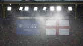 England fans drenched in leaky stadium where storm suspended Euro clash