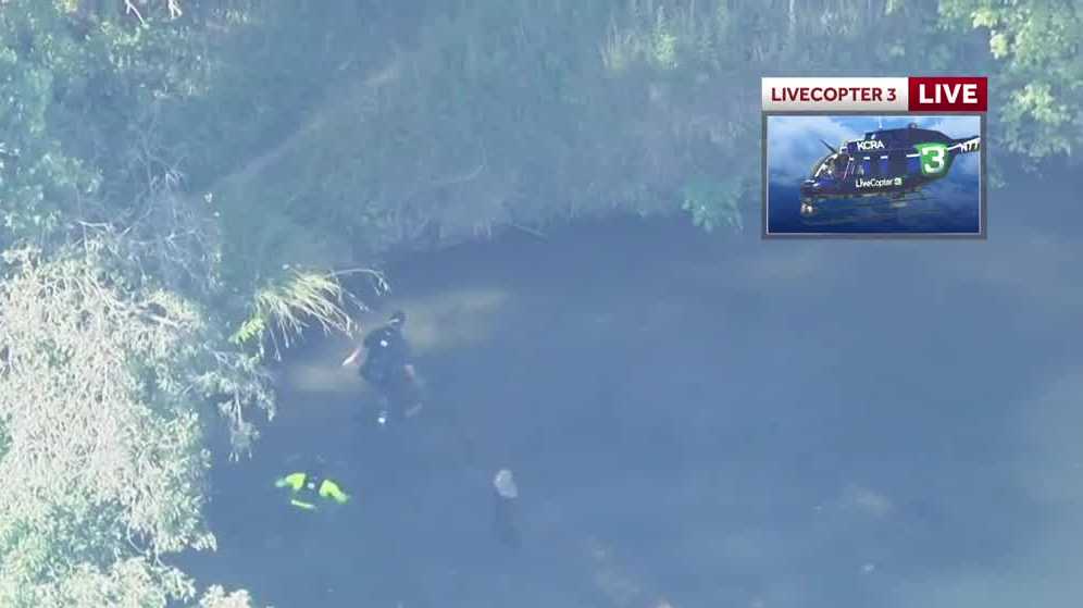 LiveCopter 3 shows firefighters rescue two people trapped by tree on American River