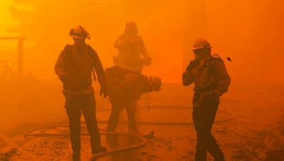 SoCal fires burn 100,000 acres, destroy dozens of homes and injure 13