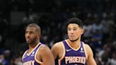 Devin Booker assists Suns' teammate Chris Paul at Elite Guard Camp for top high school, college players