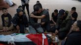A Palestinian is killed as Israeli settlers rampage in his village and troops fire on stone-throwers