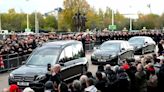 Applause for Sir Bobby Charlton's hearse at Old Trafford - as Prince William and Sir Alex Ferguson among those paying respect