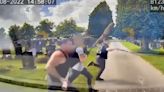 Disturbing video shows a brawl breaking out in a UK cemetery as warring families brandish machetes, hammers, and baseball bats