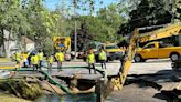 Crews work to assess damaged water main that flooded neighborhood