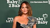 Chrissy Teigen Has Wardrobe Malfunction When Her Dress Splits Open at 2023 Baby2Baby Gala