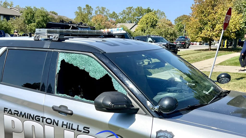 Multiple houses, police cars hit by gunfire after barricaded gunman opens fire in Farmington Hills