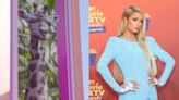 Paris Hilton names the Irwin family’s baby giraffe at Australia Zoo