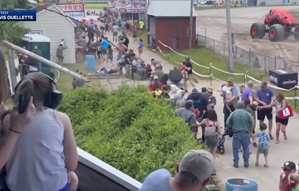 Monster truck clips power line, toppling live wires and utility poles onto spectators