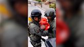 Rescuers smash roof with brick to save baby from Brazil floods