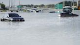 A storm dumps record rain across the desert nation of UAE and floods the Dubai airport