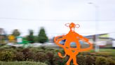 Brightly colored cows are twirling hula hoops in Keizer's roundabout. Why is that?