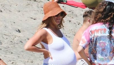 Heavily pregnant Ashley Tisdale shows off huge baby bump at beach