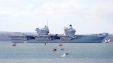 Broken down Royal Navy aircraft carrier returns to home base ahead of repairs