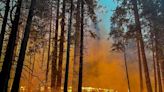 Yosemite fire grows and threatens firefighting airplanes as debris flies into the air