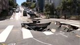 Massive sinkhole forms in SF intersection after water main break