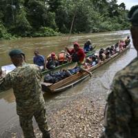 Migrants arrive at a reception center in Panama after crossing the Darien jungle from Colombia