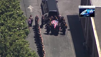 Procession delivers remains of deputy killed in line of duty to mortuary
