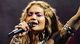 Rita Ora braves the rain as she performs in Lithuania