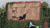 Banksy’s cat artwork to be taken down by hired contractors hours after unveiling