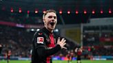 Title in sight as Leverkusen beat 10-man Wolfsburg 2-0