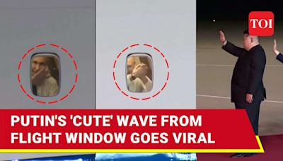 Putin 'Charms' Internet With 'Cute' Wave; Russian President Seen Peeping Through Plane Window | TOI Original - Times of India Videos