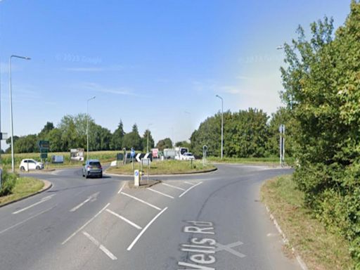 Man taken to hospital following crash near busy roundabout
