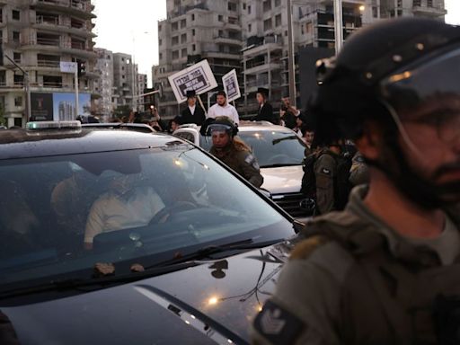 Ultra-Orthodox Jewish protesters attack Israeli minister’s car amid anger at military draft ruling