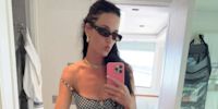 Katy Perry serves holiday style inspo in crochet beach cover-up and belly chain