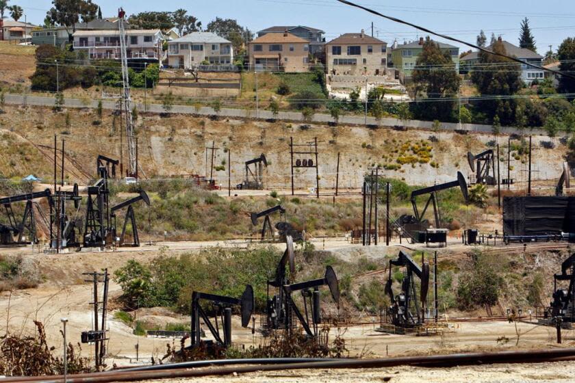 Millions of Californians live near oil and gas wells that are in the path of wildfires