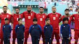 Iran players refuse to sing national anthem as fans jeer before England World Cup clash amid protests