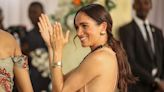 People Think Meghan Markle Was Trolling the Royal Family With Her Peach Maxi Dress in Nigeria