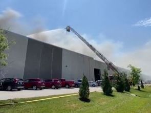 Employees evacuated after large fire at Olathe warehouse