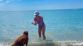 Tessa Virtue soaks up the sunshine with her dog on Canada Day weekend: 'Beach bums'