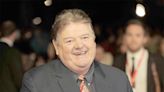 Robbie Coltrane’s son pays witty tribute to late comic dad by posting: ‘Just woke up what did I miss?’