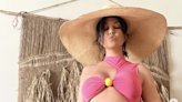Kourtney Kardashian shows off growing baby bump in swimsuit photos from Hawaii
