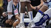 Kings guard Malik Monk injured after Dallas Mavericks star Luka Doncic falls on top of him