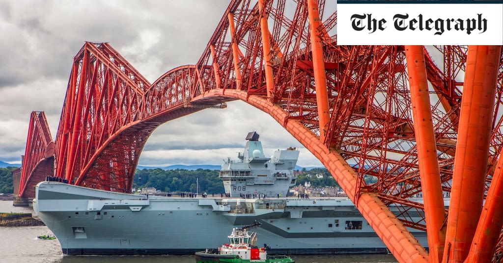 Pictured: HMS Queen Elizabeth leaves dockyard after lengthy repairs