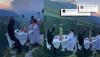 Couple’s Dare-Devil Dinner Date Dangling Over A Valley Scares The Internet: ‘Cheaper Ways To Get Broken Hips’