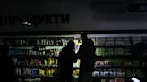 Candlelit dinners and grocery shopping in the dark: Life goes on for Ukrainians amid Russian-triggered power outages