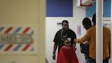 This Rochester barber offers free haircuts to motivate city students to learn