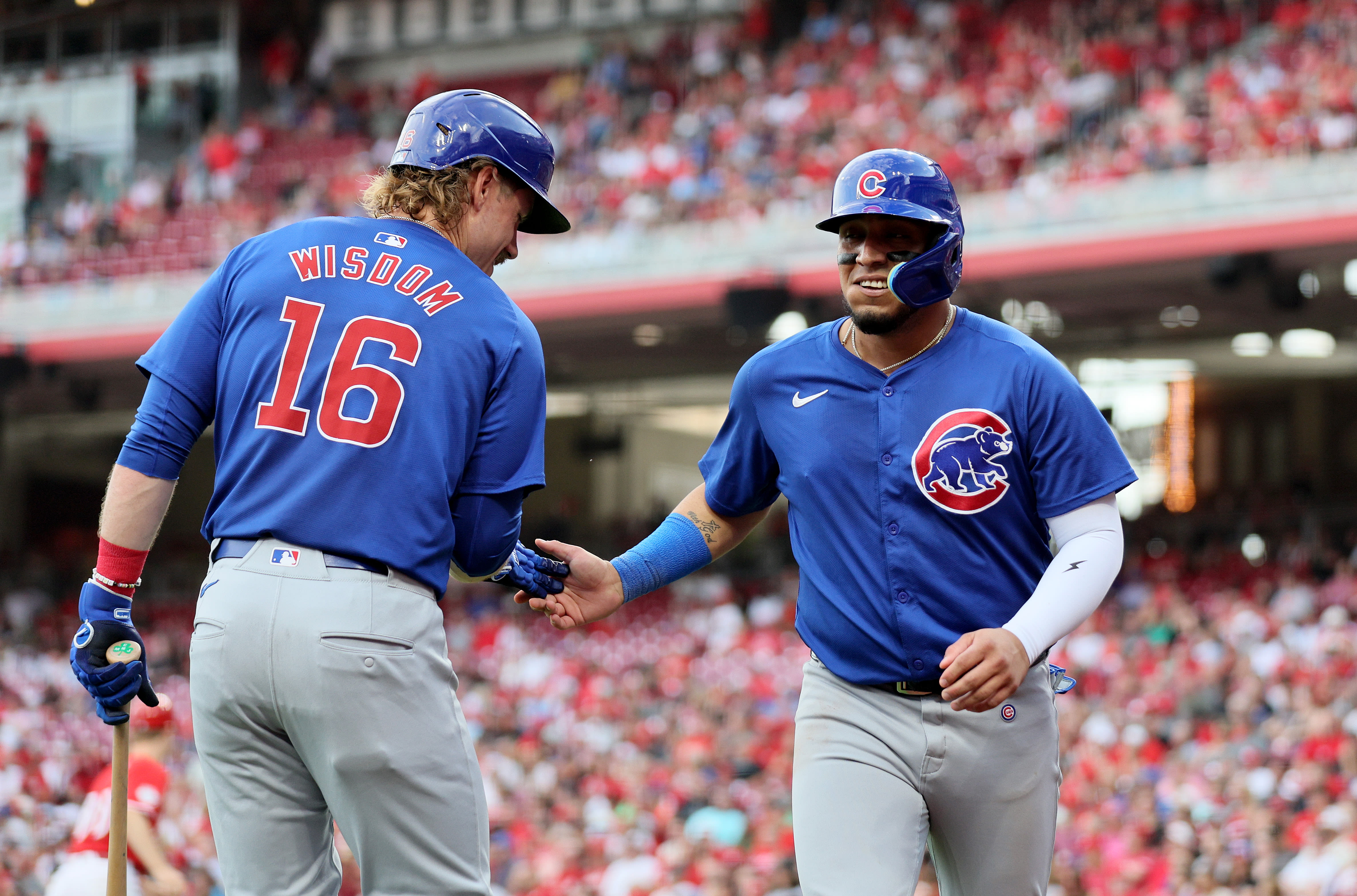 Happ launches 2-run homer and Cubs pound out 17 hits in 13-4 rout of Reds