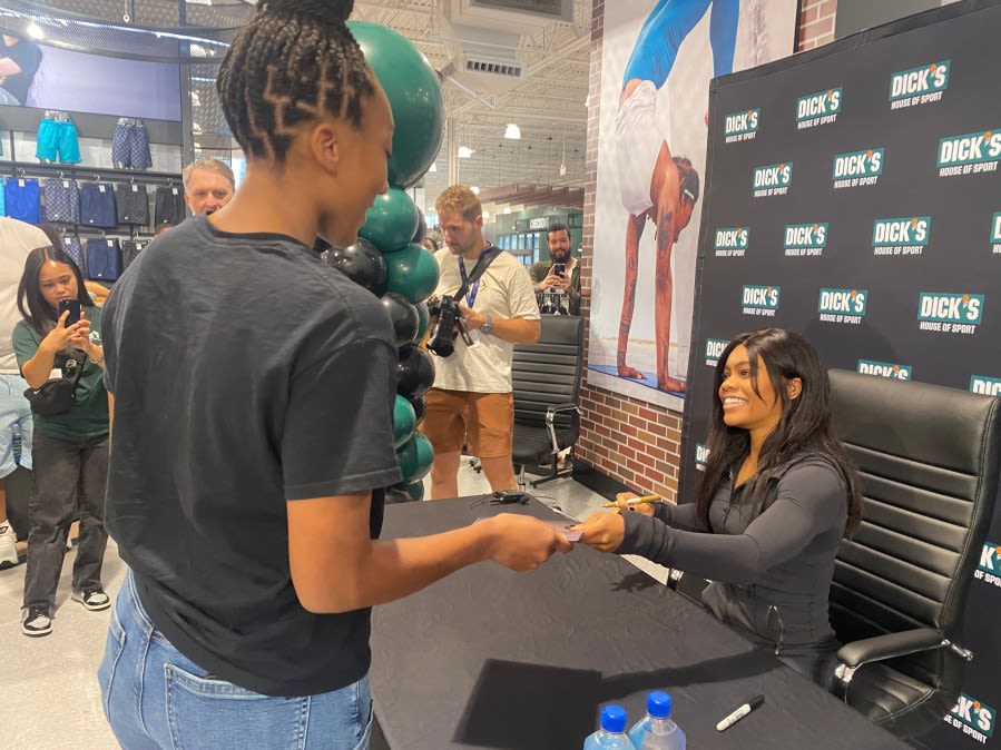 ‘Joy is your strength’ Three-time Olympic gold medalist Gabby Douglas meets long line of fans in Chesapeake