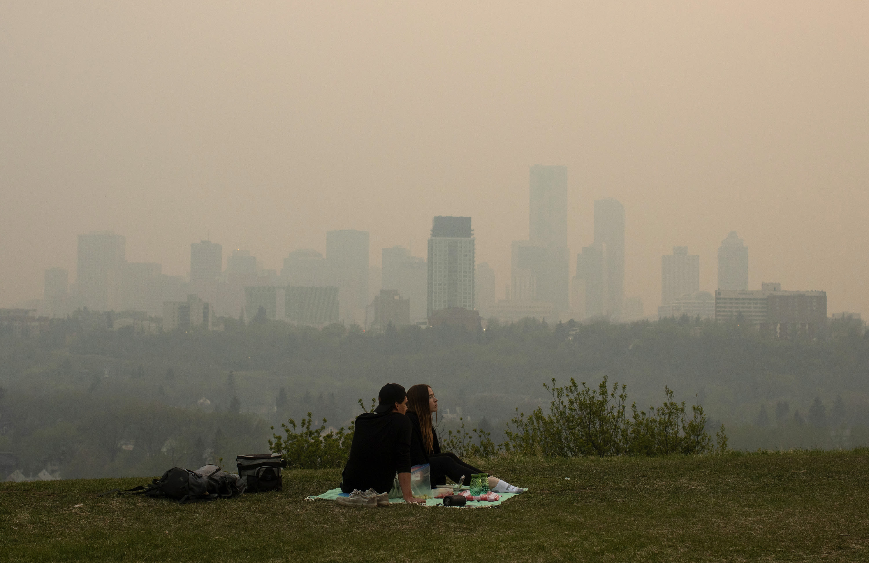 Wildfire in Canada's British Columbia forces thousands to evacuate. Winds push smoke into Alberta
