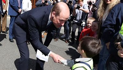 William says Kate is 'doing well' as he delights fans with surprise royal walkabout: Prince meets cheeky toddler who pretended it was his birthday to grab his attention as ...