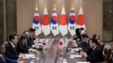 Japan, South Korea leaders tout growing 'trust' before summit with China