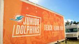 Miami Dolphins bring enthusiasm, tears with gift to Forest Hill girls flag football