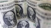 Dollar steady as traders await clues on US rate path