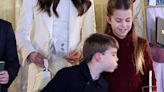 Cheeky Prince Louis blows out sister Charlotte's candle at Kate's Xmas concert