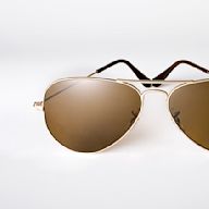 Originally designed for pilots, aviator sunglasses have a teardrop shape and thin metal frames. They are popular for their classic and timeless look, and are often seen as a symbol of coolness and adventure. They are suitable for most face shapes and are available in a variety of lens colors.