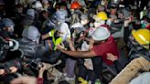 Police officer fired gun while clearing protesters from Columbia building, prosecutors say